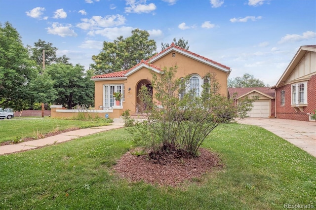 1295 S Downing St, Denver, CO 80210 - mediterranean / spanish home with driveway, stucco siding, a front yard, a garage, and a tiled roof
