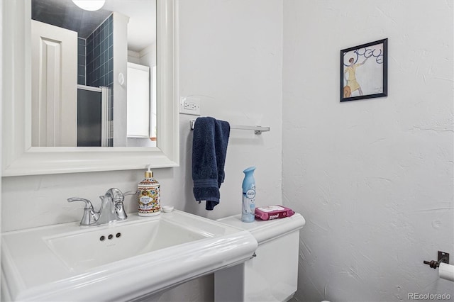1295 S Downing St, Denver, CO 80210 - bathroom featuring toilet and a shower with shower door