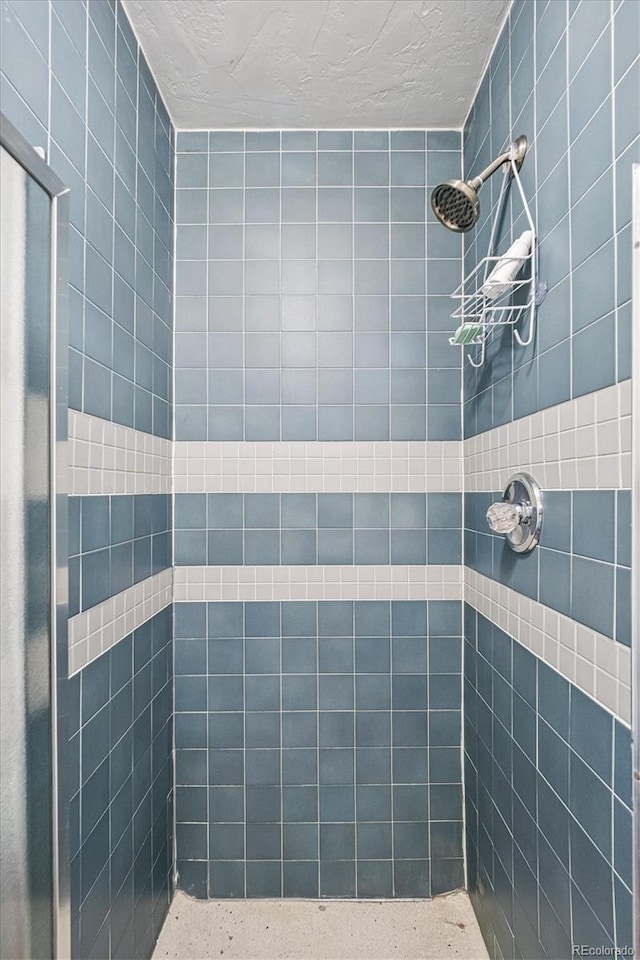 1295 S Downing St, Denver, CO 80210 - full bath with a tile shower and a textured ceiling