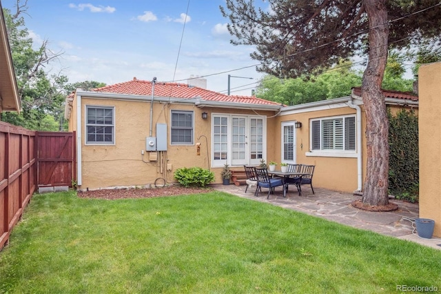 1295 S Downing St, Denver, CO 80210 - rear view of house with stucco siding, a patio area, and a tiled roof