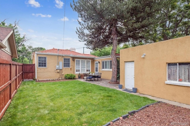 1295 S Downing St, Denver, CO 80210 - rear view of house featuring stucco siding, a fenced backyard, and a patio