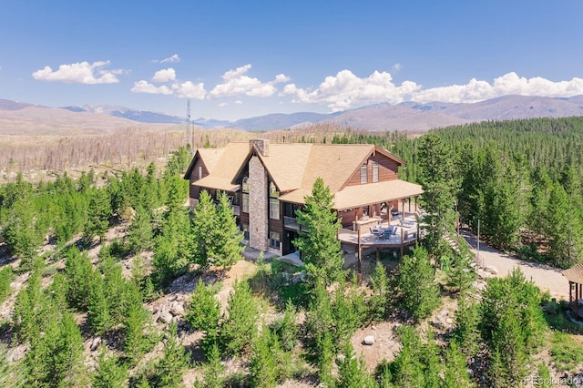 property view of mountains featuring a view of trees