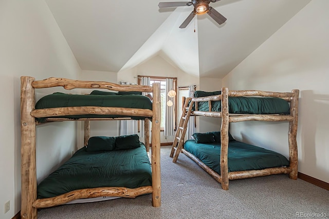 carpeted bedroom with vaulted ceiling, a ceiling fan, and baseboards