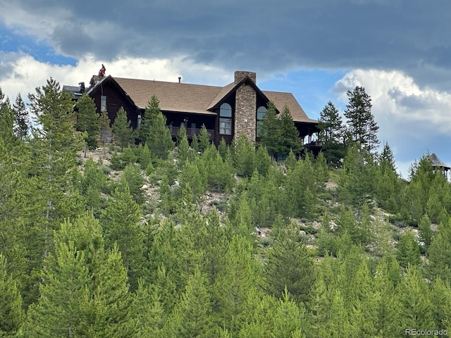 view of home's exterior with a chimney