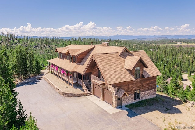 drone / aerial view with a view of trees