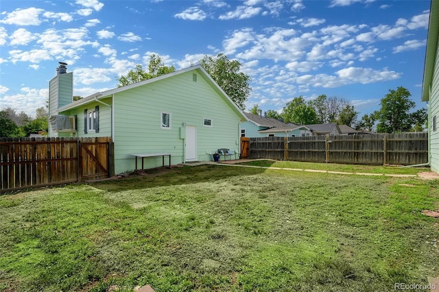 1391 Elmira St, Aurora, CO 80010 - rear view of house with a chimney