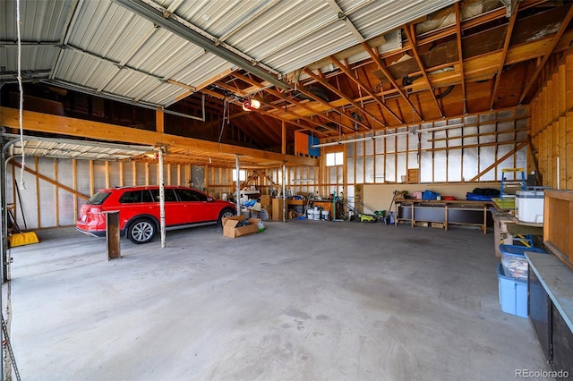 1391 Elmira St, Aurora, CO 80010 - garage featuring a workshop area