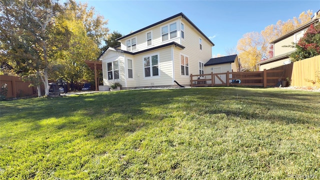 back of house featuring cooling unit and a lawn