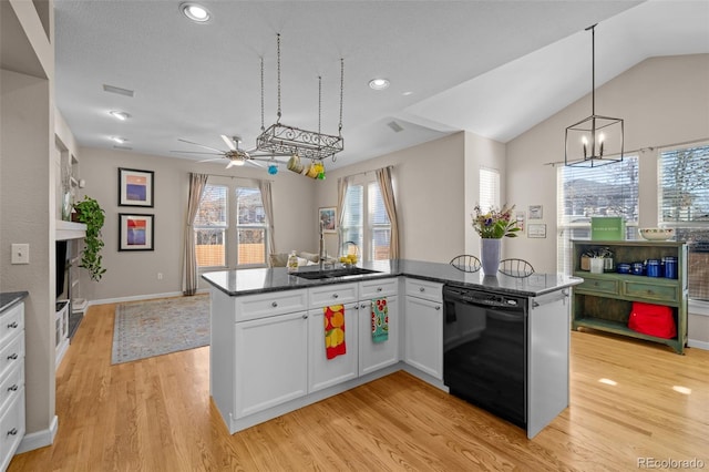 kitchen with sink, dishwasher, hanging light fixtures, white cabinets, and light wood-type flooring