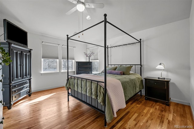 bedroom with hardwood / wood-style floors