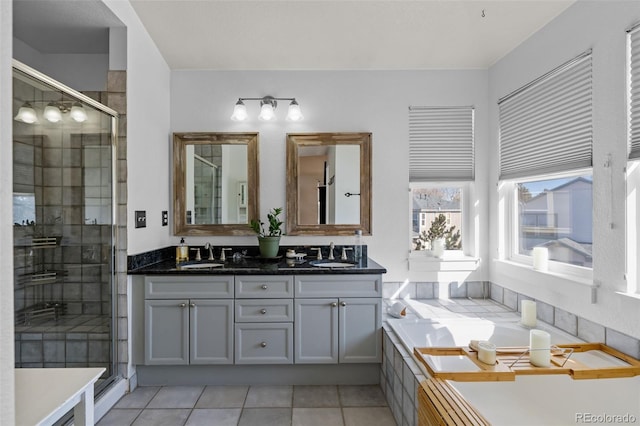 bathroom featuring tile patterned floors, vanity, and independent shower and bath