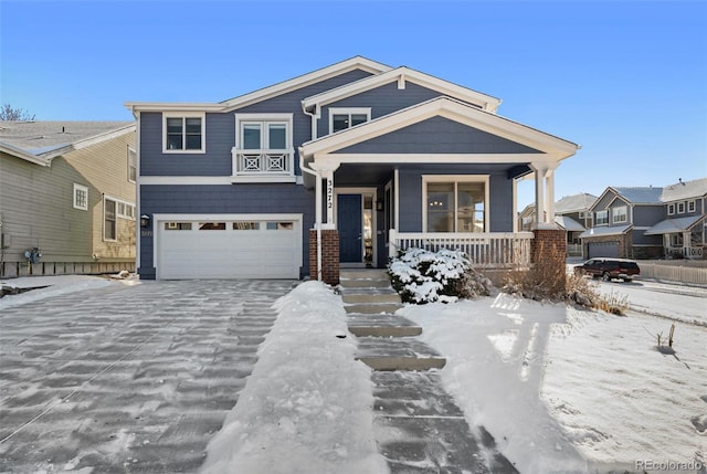 view of front of property with a porch and a garage