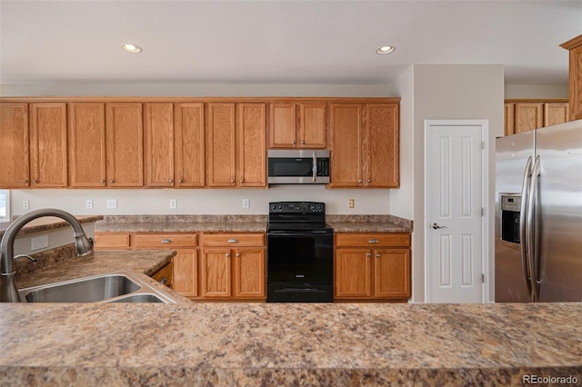 kitchen featuring stainless steel appliances and sink