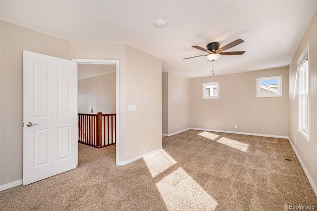 carpeted empty room with ceiling fan