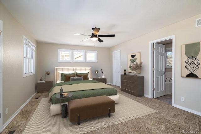 bedroom with carpet, ceiling fan, and ensuite bathroom