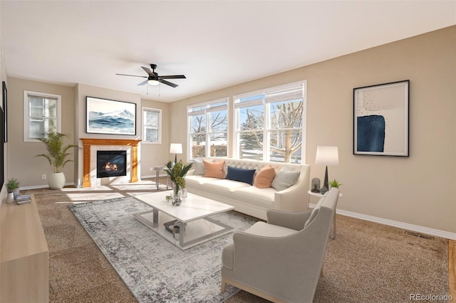 carpeted living room featuring ceiling fan