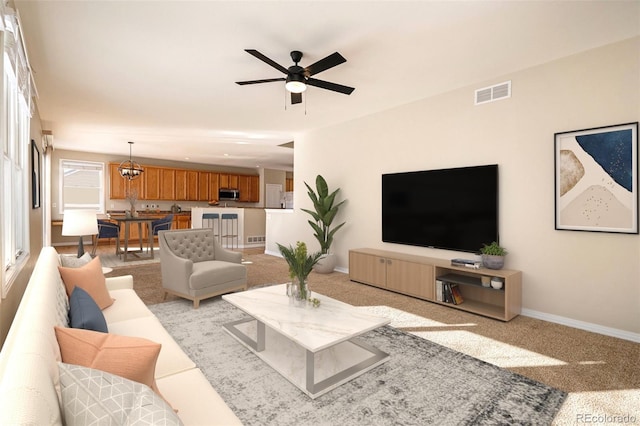 living room with ceiling fan with notable chandelier