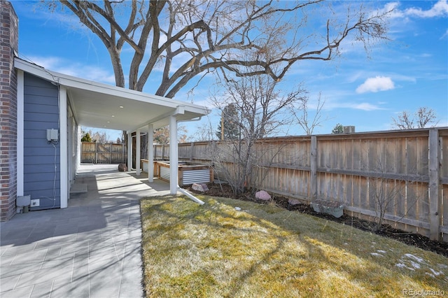 view of yard with a patio area and a fenced backyard