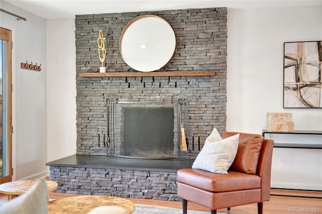 interior space with a fireplace and light wood finished floors