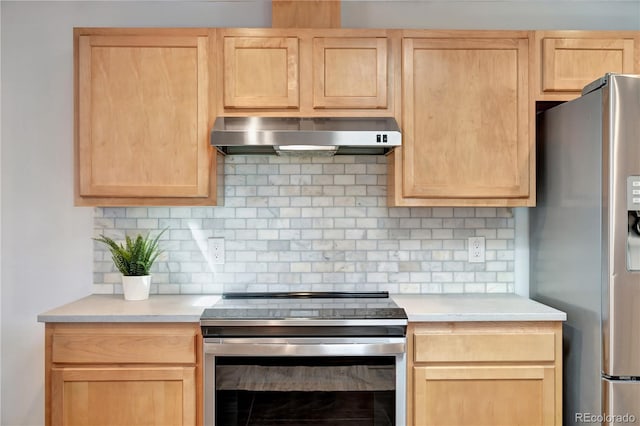 kitchen featuring appliances with stainless steel finishes, light brown cabinets, light countertops, and ventilation hood