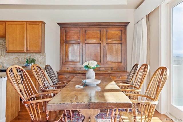 dining space with light wood finished floors