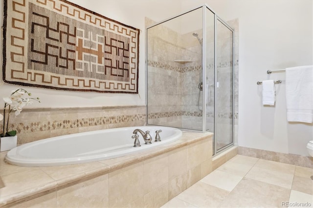bathroom with a garden tub, tile patterned flooring, and a stall shower