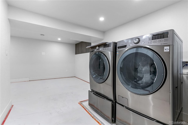 laundry area with washing machine and dryer