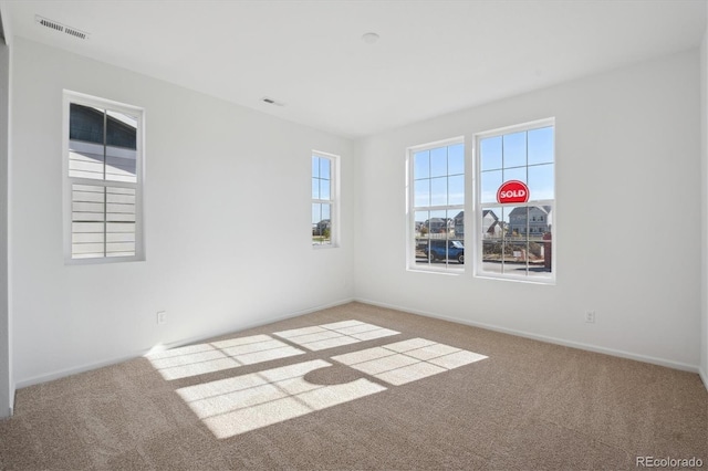 unfurnished room featuring carpet floors