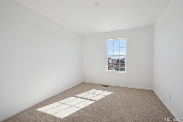 empty room with carpet flooring