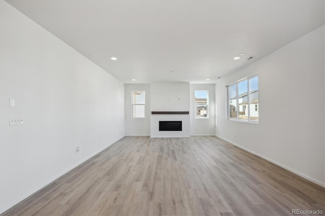 unfurnished living room with light hardwood / wood-style floors