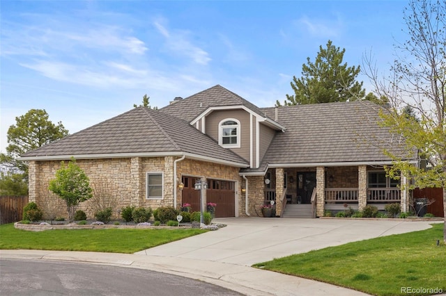 7836 S Fairfax Ct, Centennial, CO 80122 - french country inspired facade featuring stone siding, a garage, a porch, a front yard, and driveway
