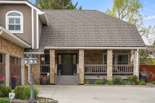 7836 S Fairfax Ct, Centennial, CO 80122 - view of front of property with covered porch and stone siding