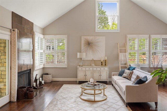 7836 S Fairfax Ct, Centennial, CO 80122 - living room featuring wood finished floors, a healthy amount of sunlight, and high vaulted ceiling