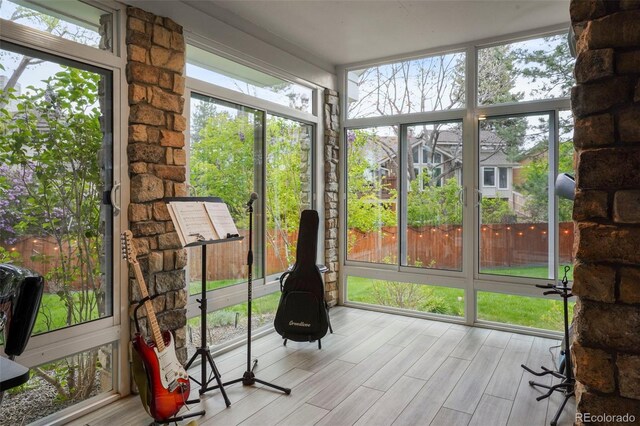 7836 S Fairfax Ct, Centennial, CO 80122 - unfurnished sunroom featuring wood finished floors