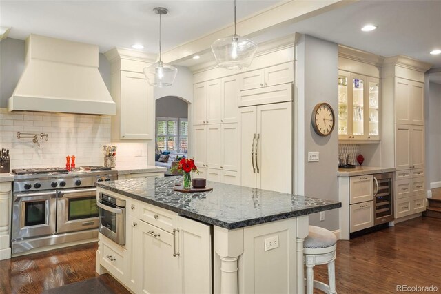7836 S Fairfax Ct, Centennial, CO 80122 - kitchen with wine cooler, custom exhaust hood, dark wood finished floors, backsplash, and premium appliances