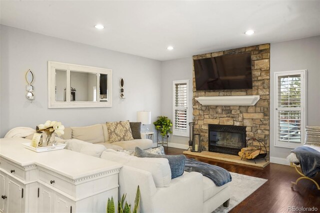 7836 S Fairfax Ct, Centennial, CO 80122 - living room with recessed lighting, baseboards, wood finished floors, and a fireplace