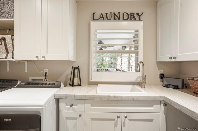 7836 S Fairfax Ct, Centennial, CO 80122 - clothes washing area with cabinet space, washer and clothes dryer, and a sink