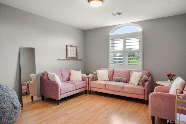 7836 S Fairfax Ct, Centennial, CO 80122 - living room featuring visible vents and light wood-style floors