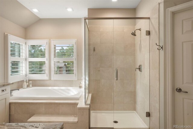 7836 S Fairfax Ct, Centennial, CO 80122 - full bathroom with a garden tub, lofted ceiling, and a stall shower