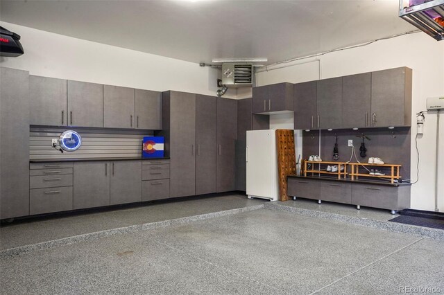 7836 S Fairfax Ct, Centennial, CO 80122 - garage featuring freestanding refrigerator