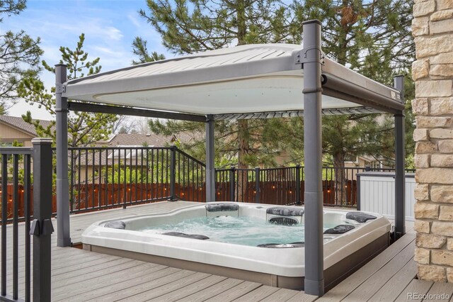 7836 S Fairfax Ct, Centennial, CO 80122 - deck featuring hot tub deck surround