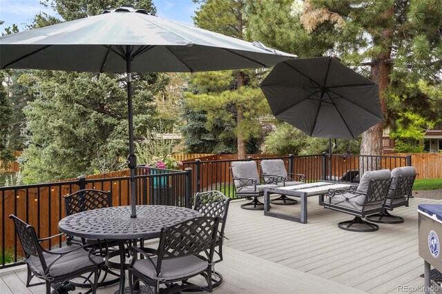 7836 S Fairfax Ct, Centennial, CO 80122 - deck with an outdoor living space, fence, and outdoor dining space
