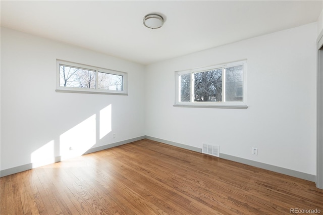 empty room featuring wood-type flooring