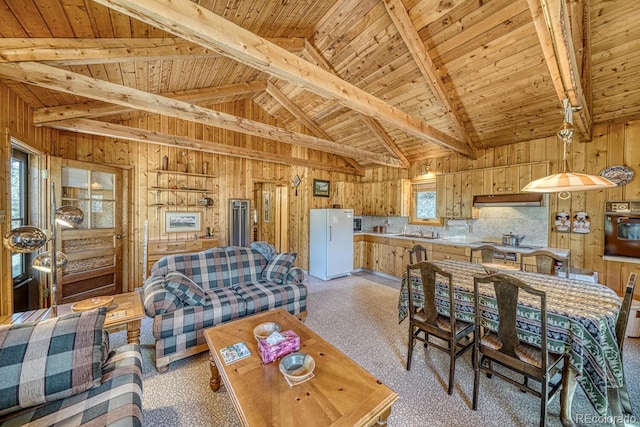 living room featuring wood walls, light carpet, wooden ceiling, and lofted ceiling with beams