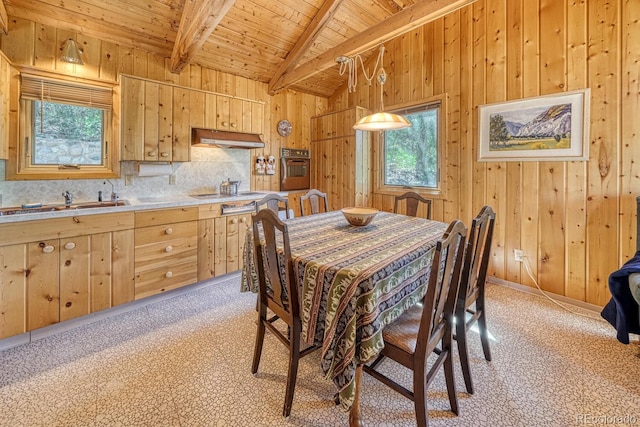 dining room with wood walls, light colored carpet, lofted ceiling with beams, and wooden ceiling