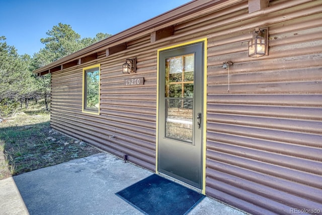 doorway to property featuring a patio