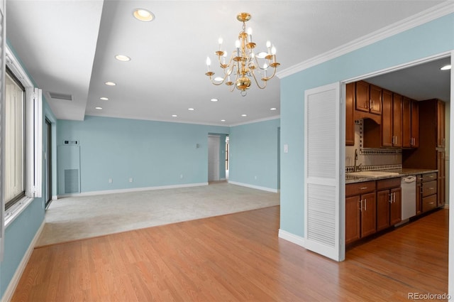 kitchen featuring sink, light stone counters, light wood-type flooring, crown molding, and white dishwasher