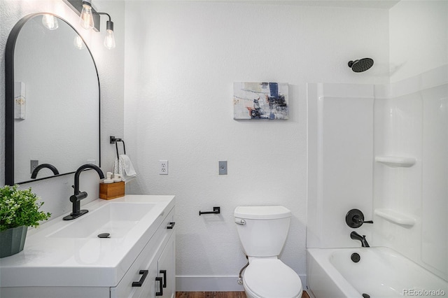 full bathroom featuring bathtub / shower combination, toilet, vanity, wood finished floors, and baseboards