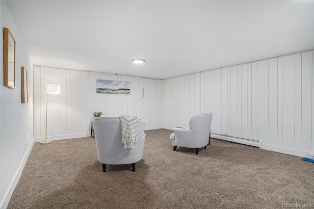 sitting room with a baseboard radiator, baseboards, and carpet