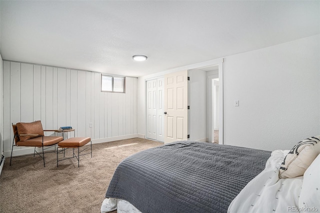 carpeted bedroom featuring baseboards